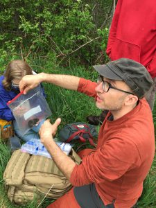 photo of alessio mortelliti working in the field