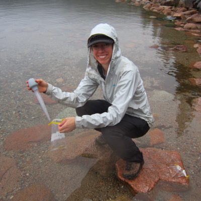 photo of Abbey Paulson taking a water sample