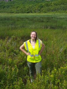 scientist sara McBride standing out in field